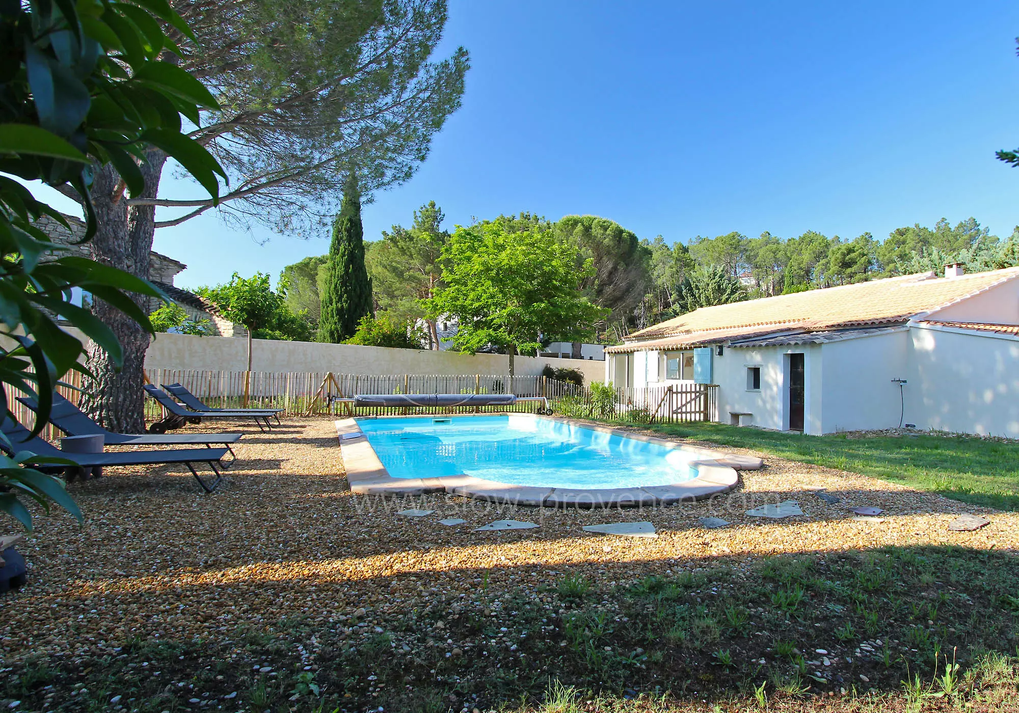 A heated pool at the back of the house