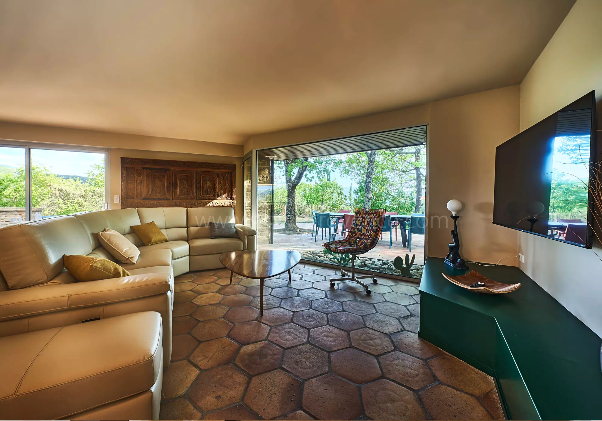 A spacious lounge with a garden view