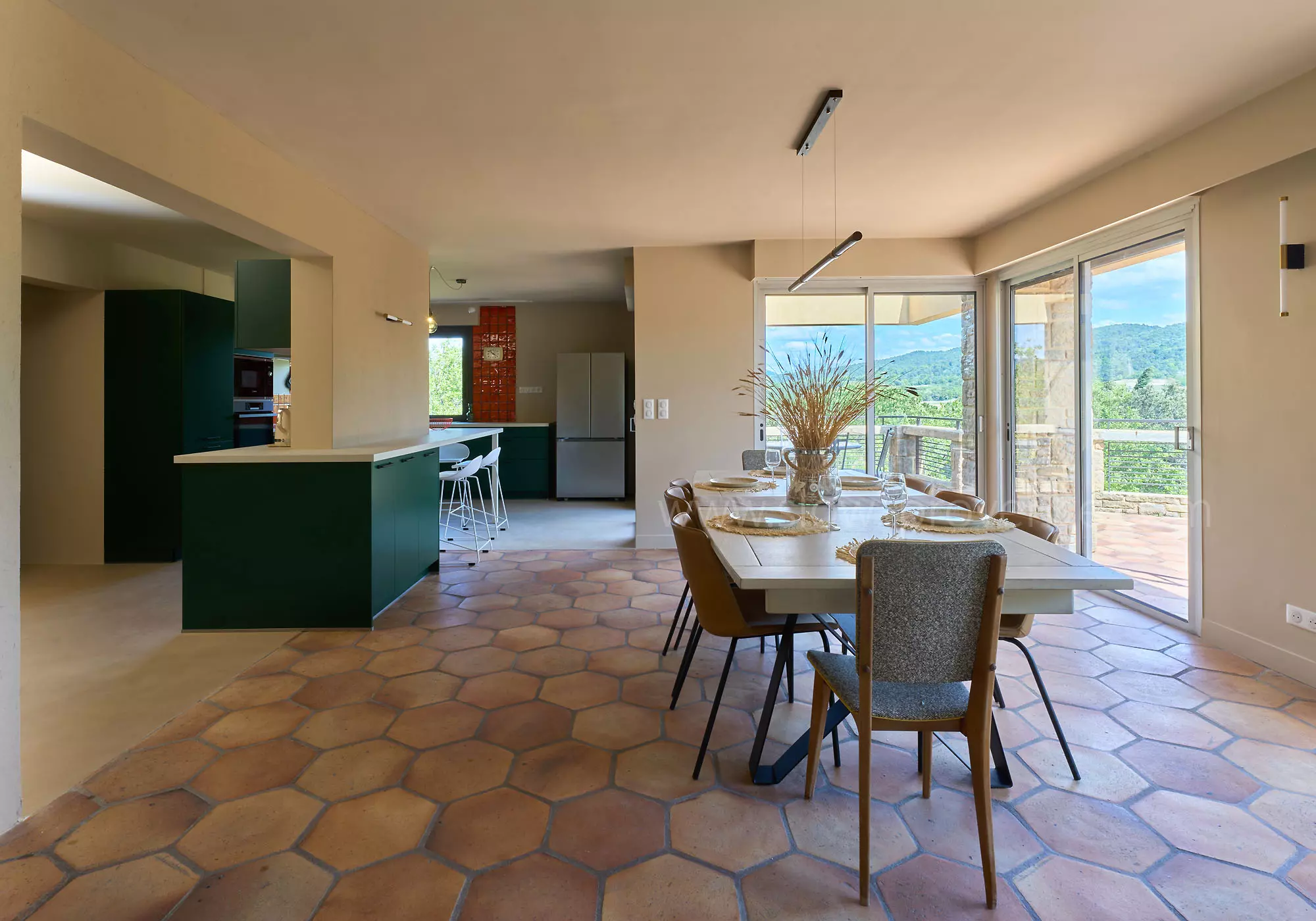 A spacious living room opening onto the terrace