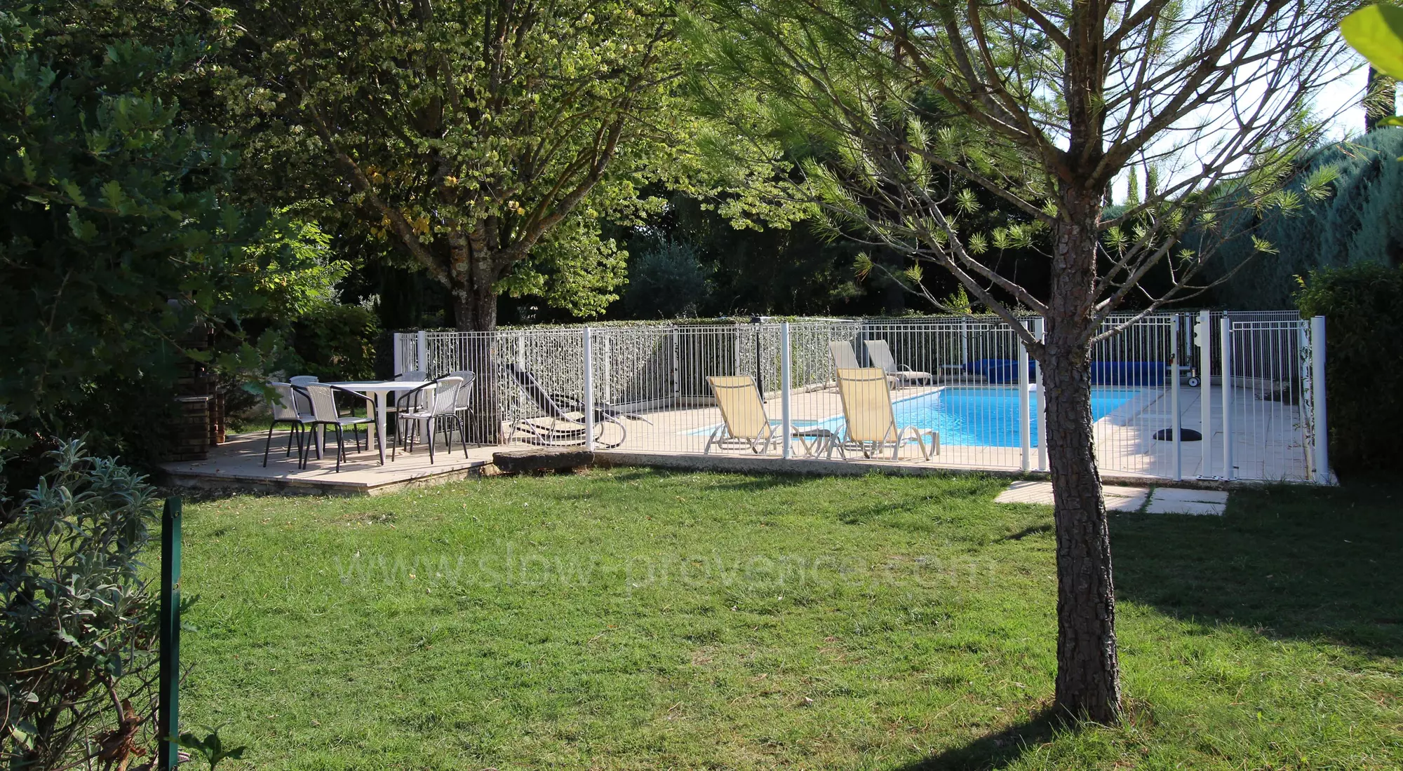 Shaded dining area with barbecue