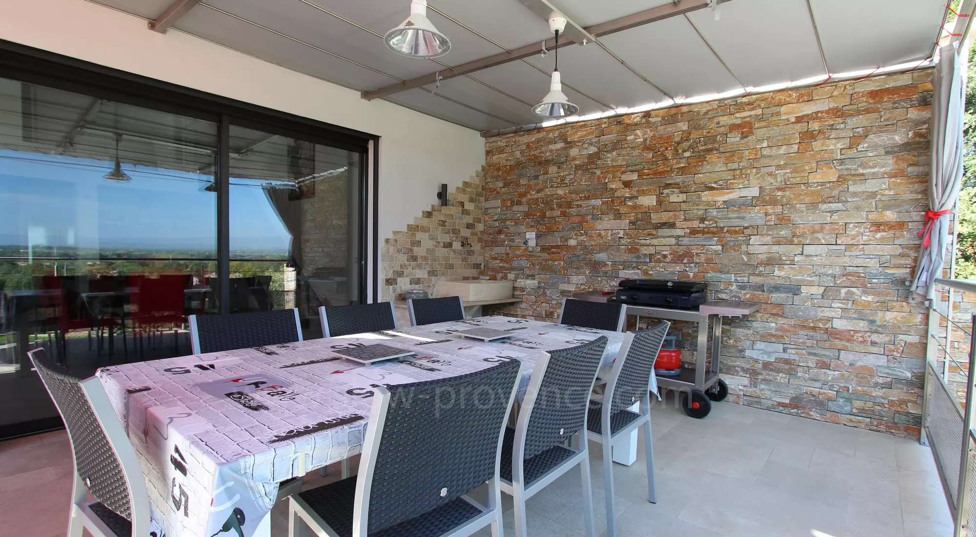 Terrace shaded by an arbour