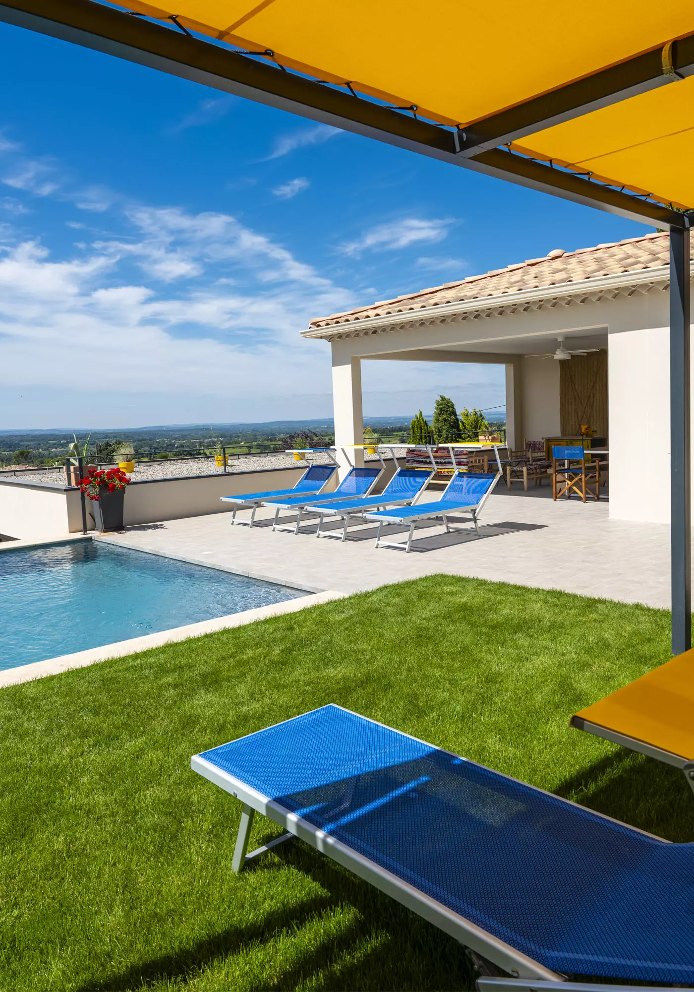 Swimming pool with sun loungers