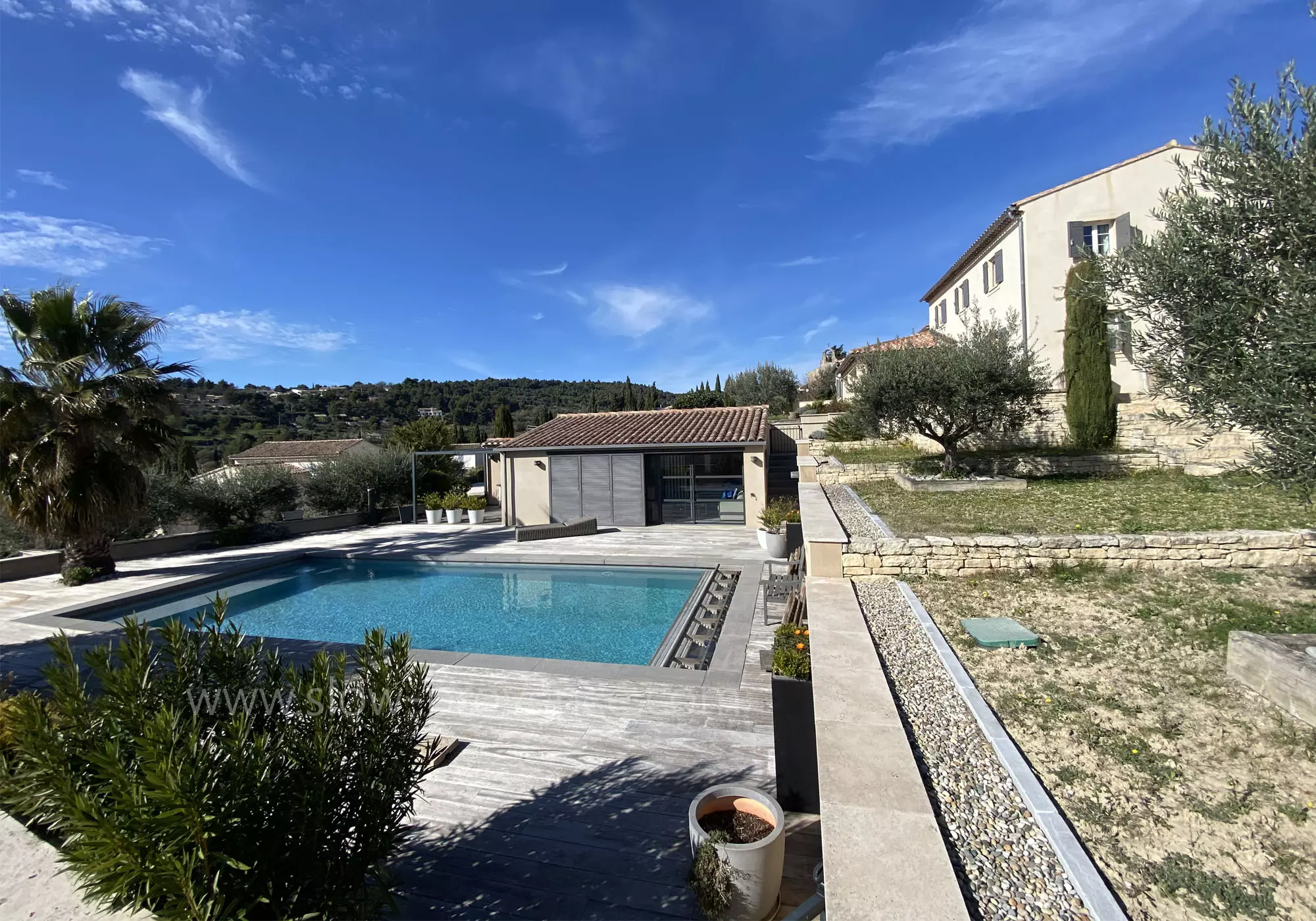 The main house, the cottage and the pool